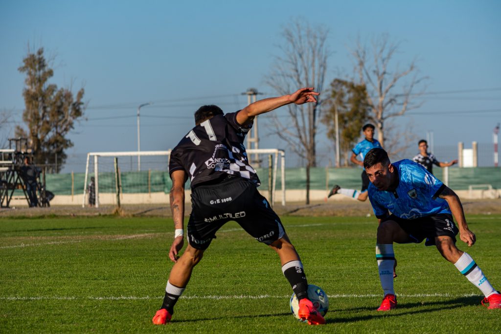 Two football players challenging for the ball during a match, illustrating the unpredictability behind Correct Score betting